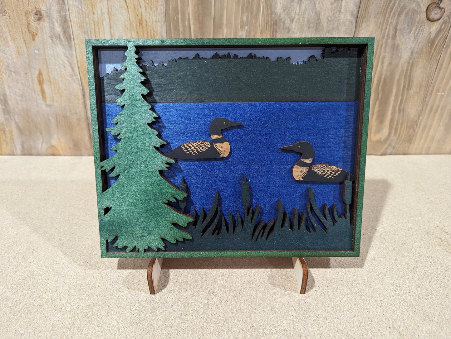 Two Loons swimming in a lake. Layered Wood Sign. Magnet option.