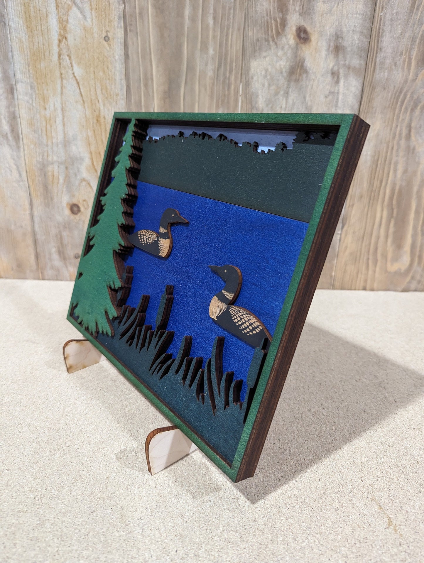 Two Loons swimming in a lake. Layered Wood Sign. Magnet option.