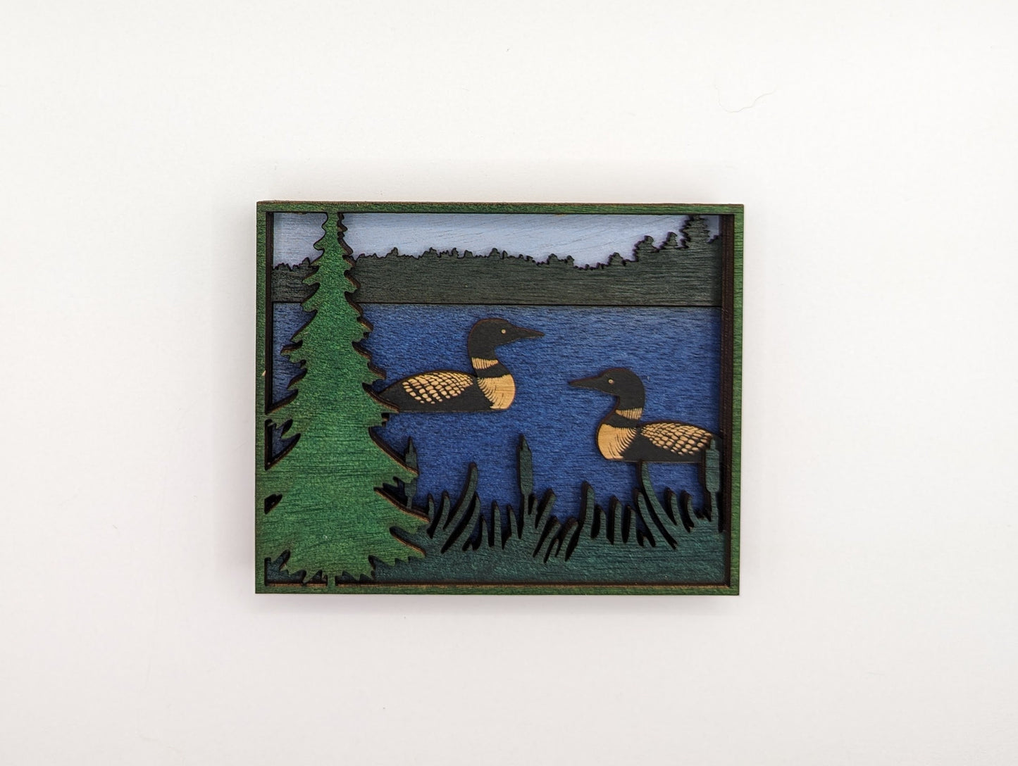 Two Loons swimming in a lake. Layered Wood Sign. Magnet option.